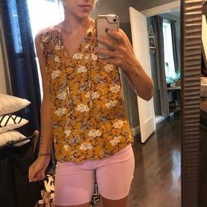 Yellow floral print, sleeveless top.